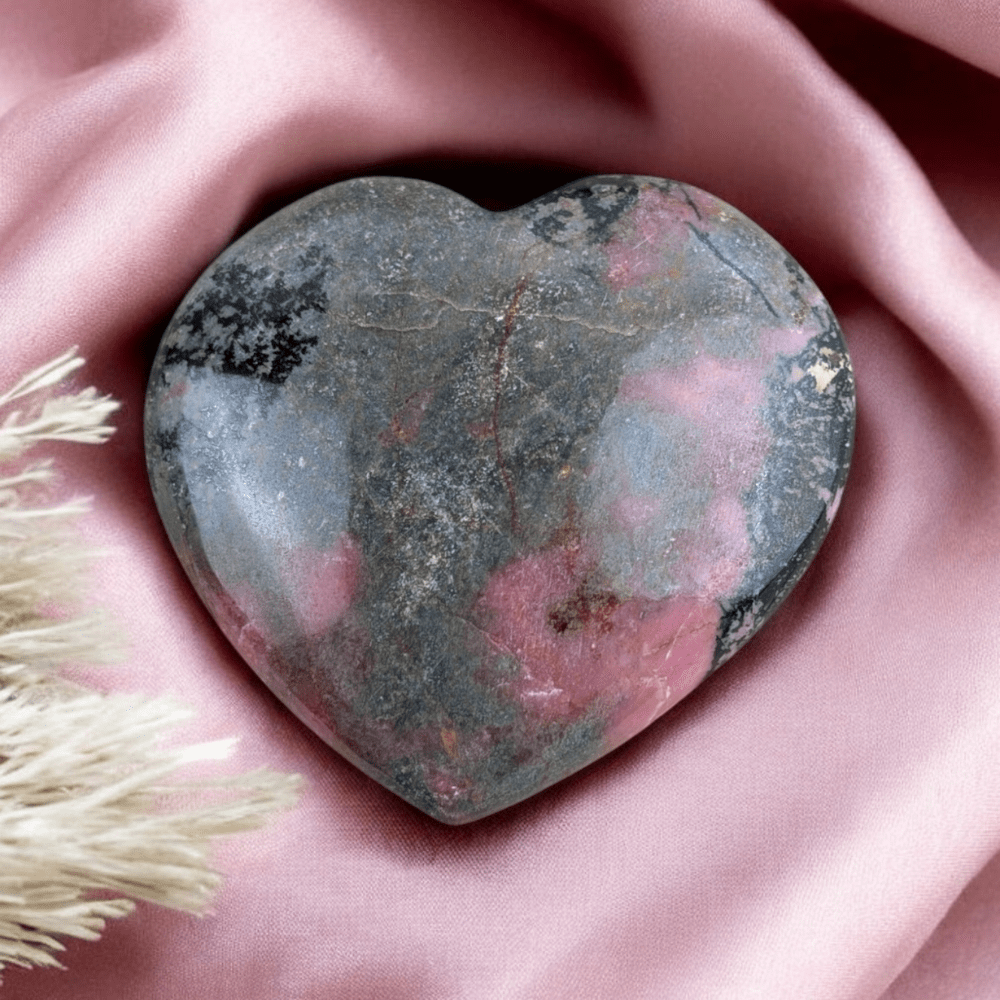 Rhodonite palm stone for emotional release and closure