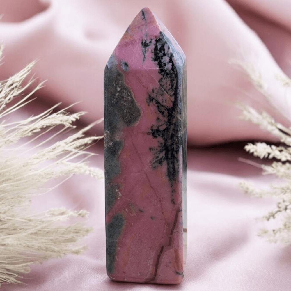 Rhodonite crystal for emotional healing, self-love, and balance.
