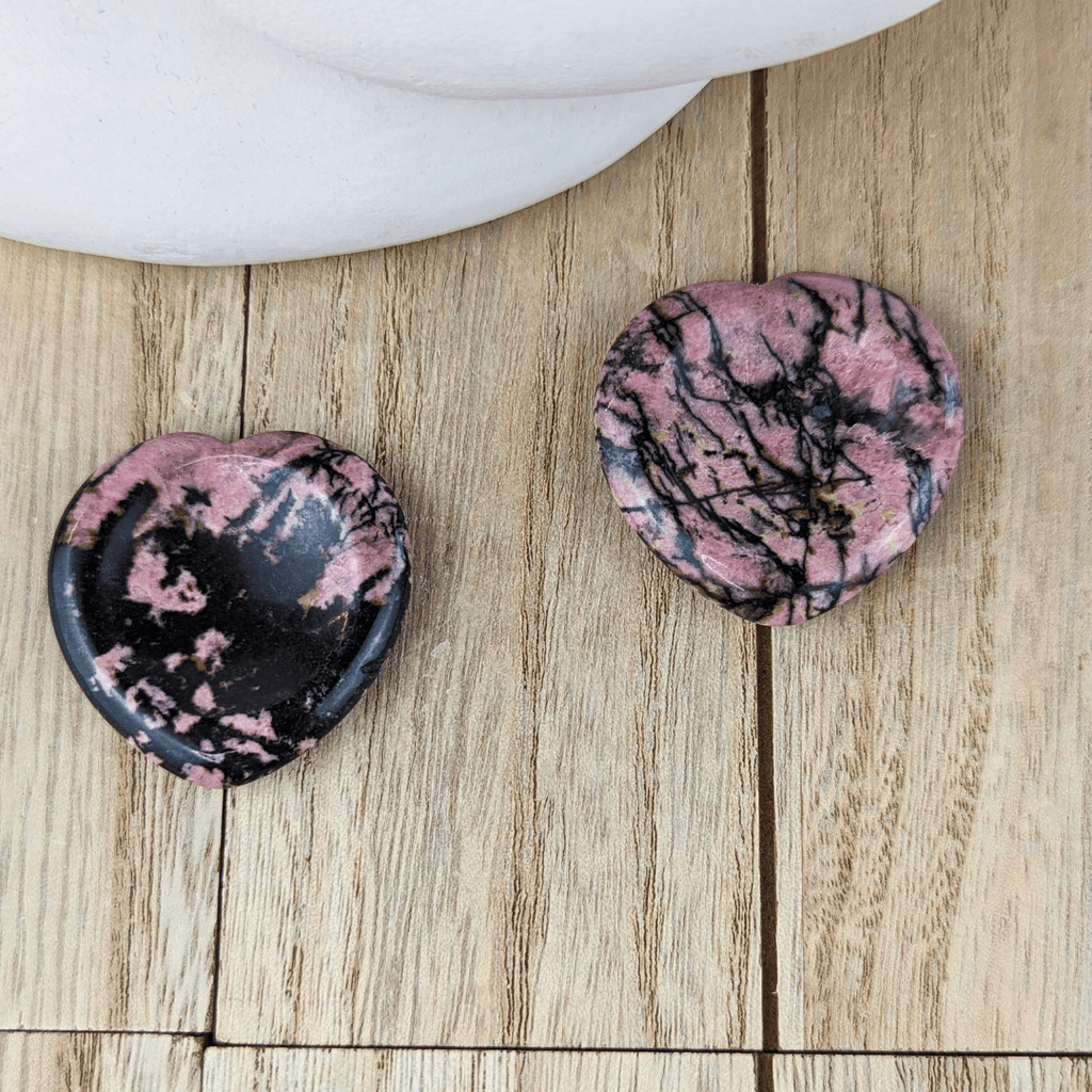 Rhodonite crystal for emotional healing, self-love, and balance.