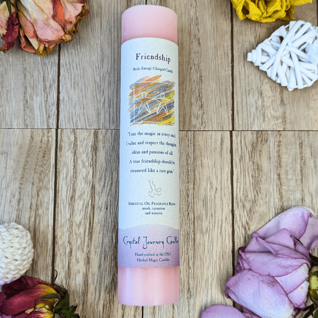 Friendship ritual candle with herbs and crystals