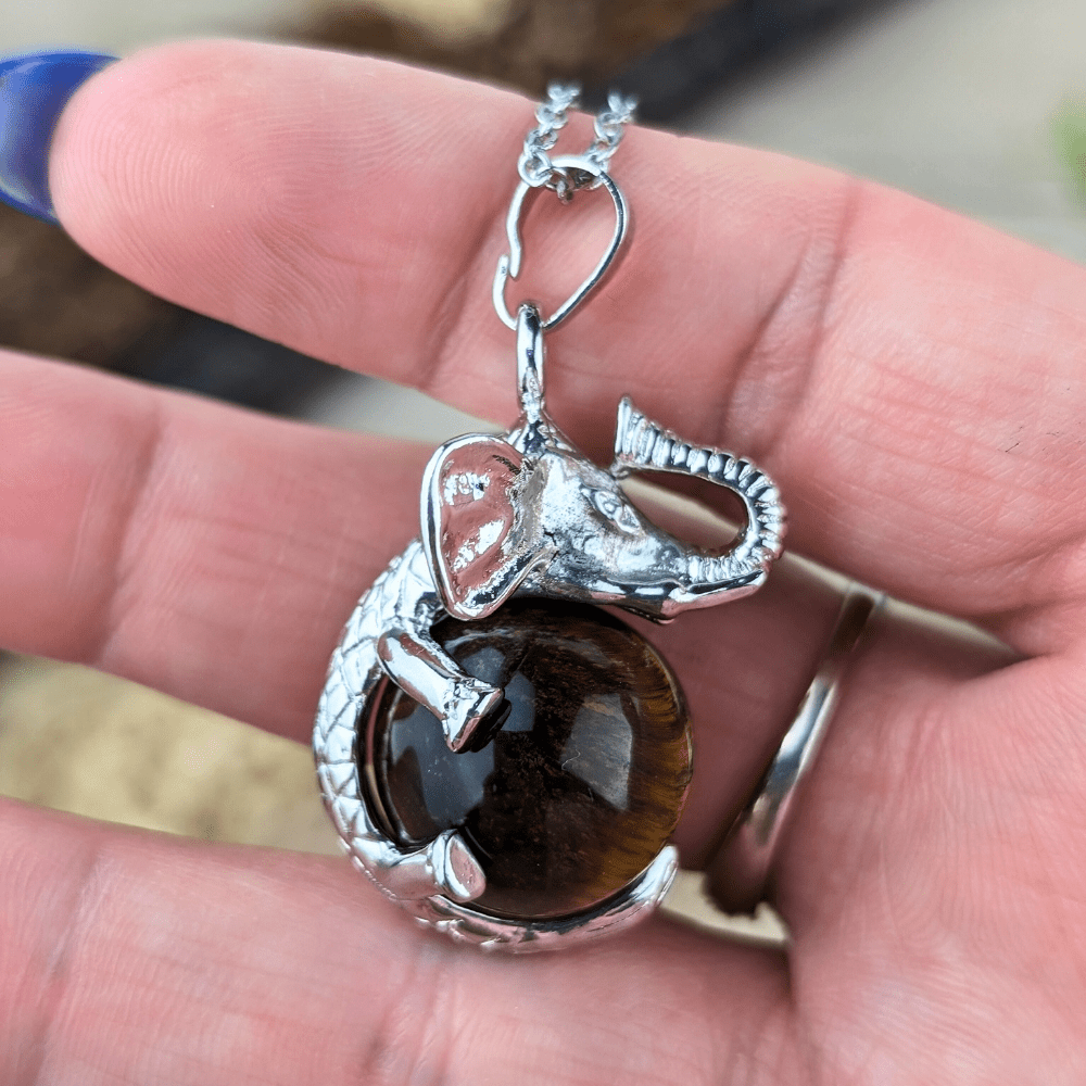  Tigers Eye Elephant Necklace invites protection, strength, and good fortune into your life. Available at Zen Collection , order today.
