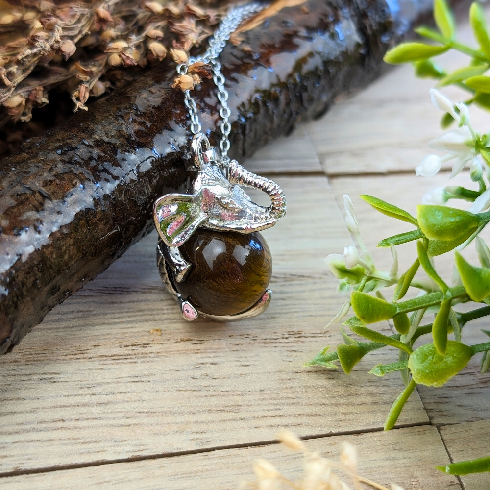  Tigers Eye Elephant Necklace invites protection, strength, and good fortune into your life. Available at Zen Collection , order today.