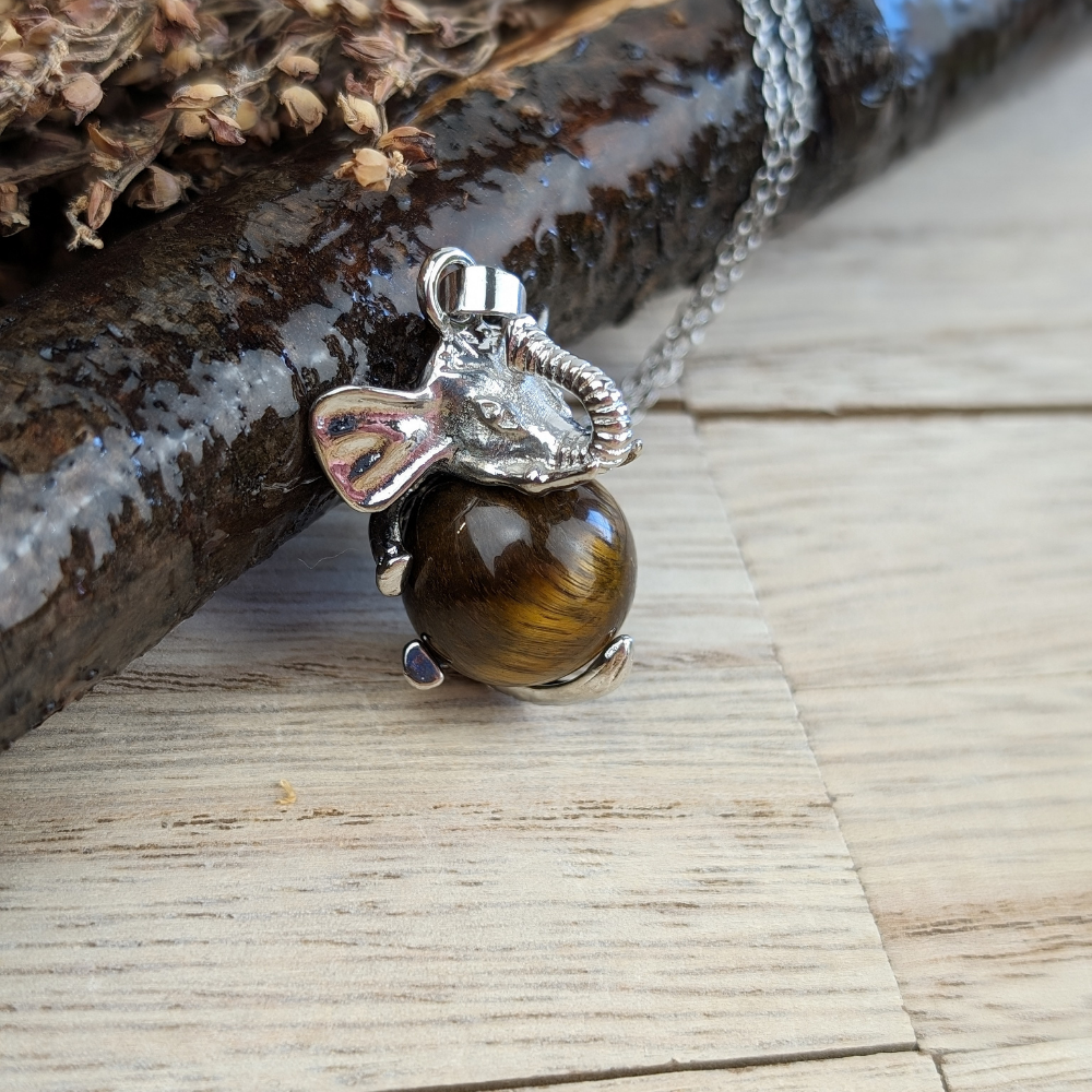  Tigers Eye Elephant Necklace invites protection, strength, and good fortune into your life. Available at Zen Collection , order today.