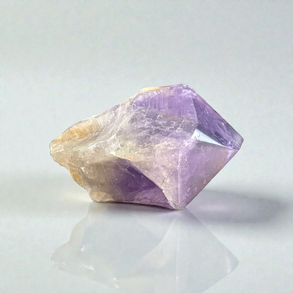 Close-up of Amethyst Crystal Point showing deep violet hues and inclusions picture taken by zen collection crystal store in Barrie