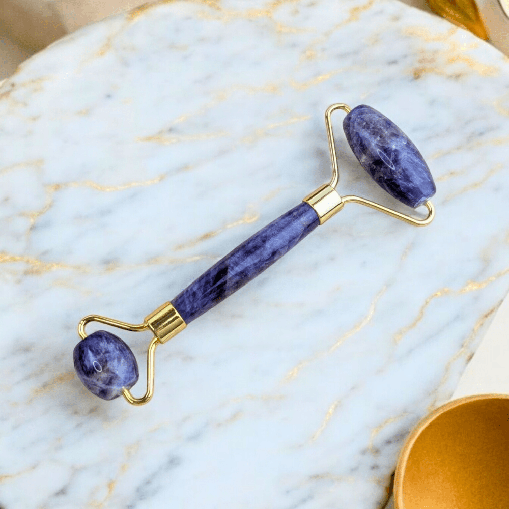 Amethyst facial roller with gold accents