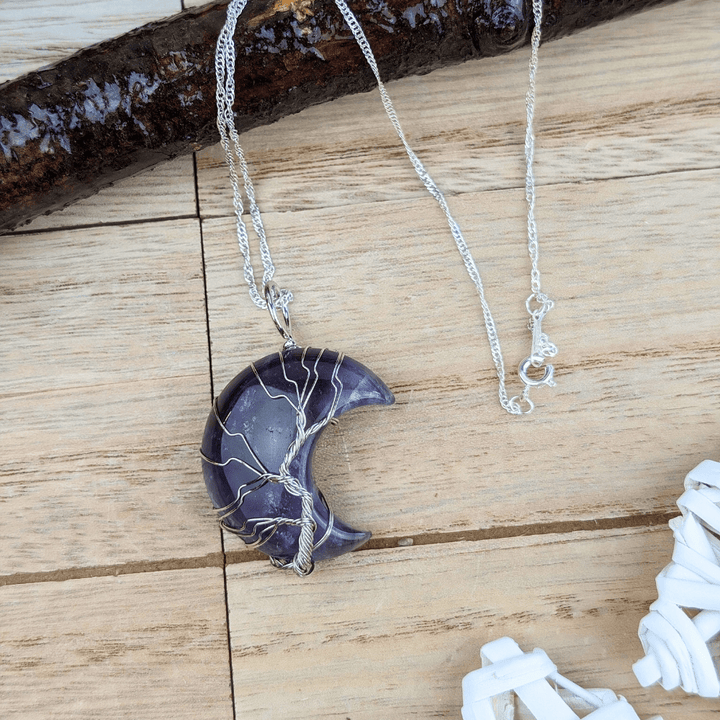 Spiritual amethyst moon necklace, symbol of peace, protection, and intuition.