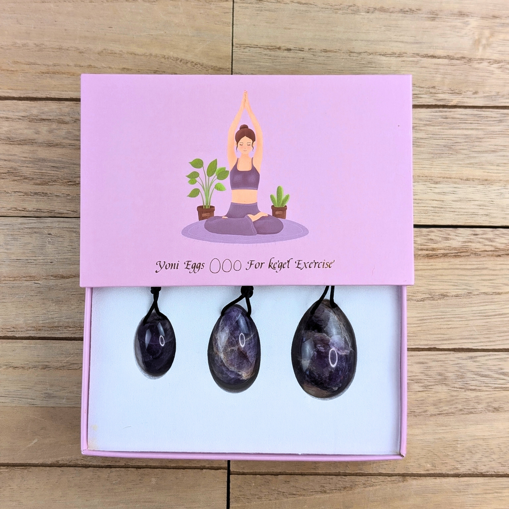 lose-up of Amethyst Yoni Egg - A detailed view of the amethyst yoni egg, showcasing its deep purple hues and natural patterns.