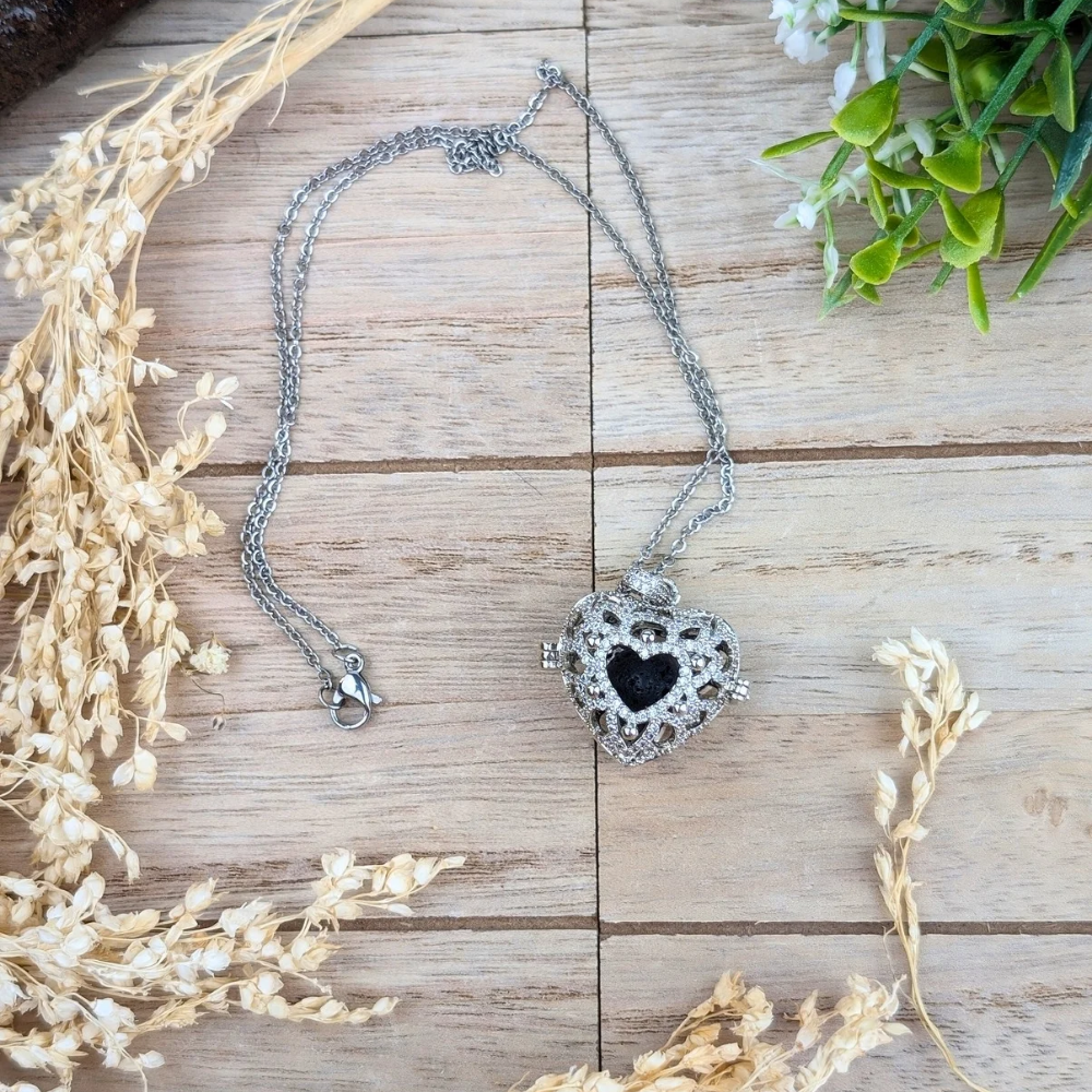 Aromatherapy necklace with silver filigree design and black lava stone