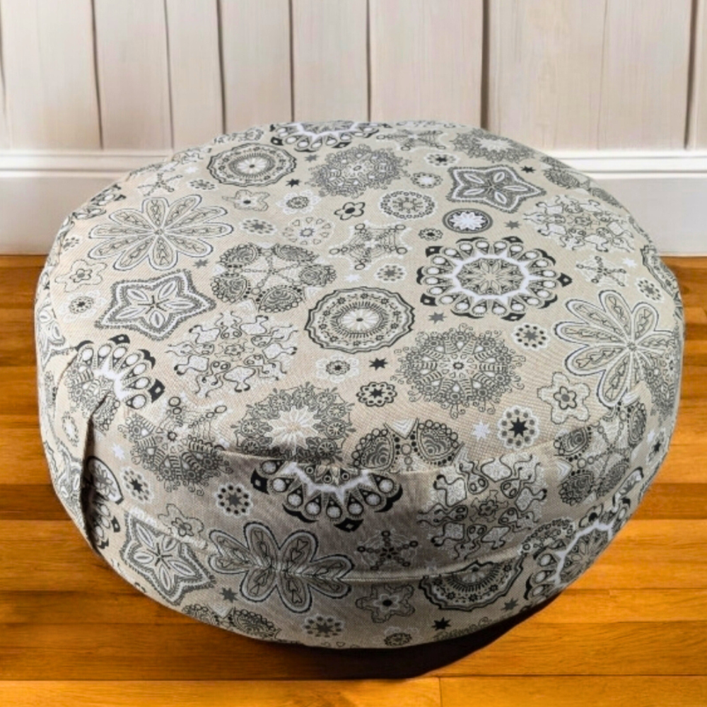 Close-up of zafu meditation cushion with black mandala design