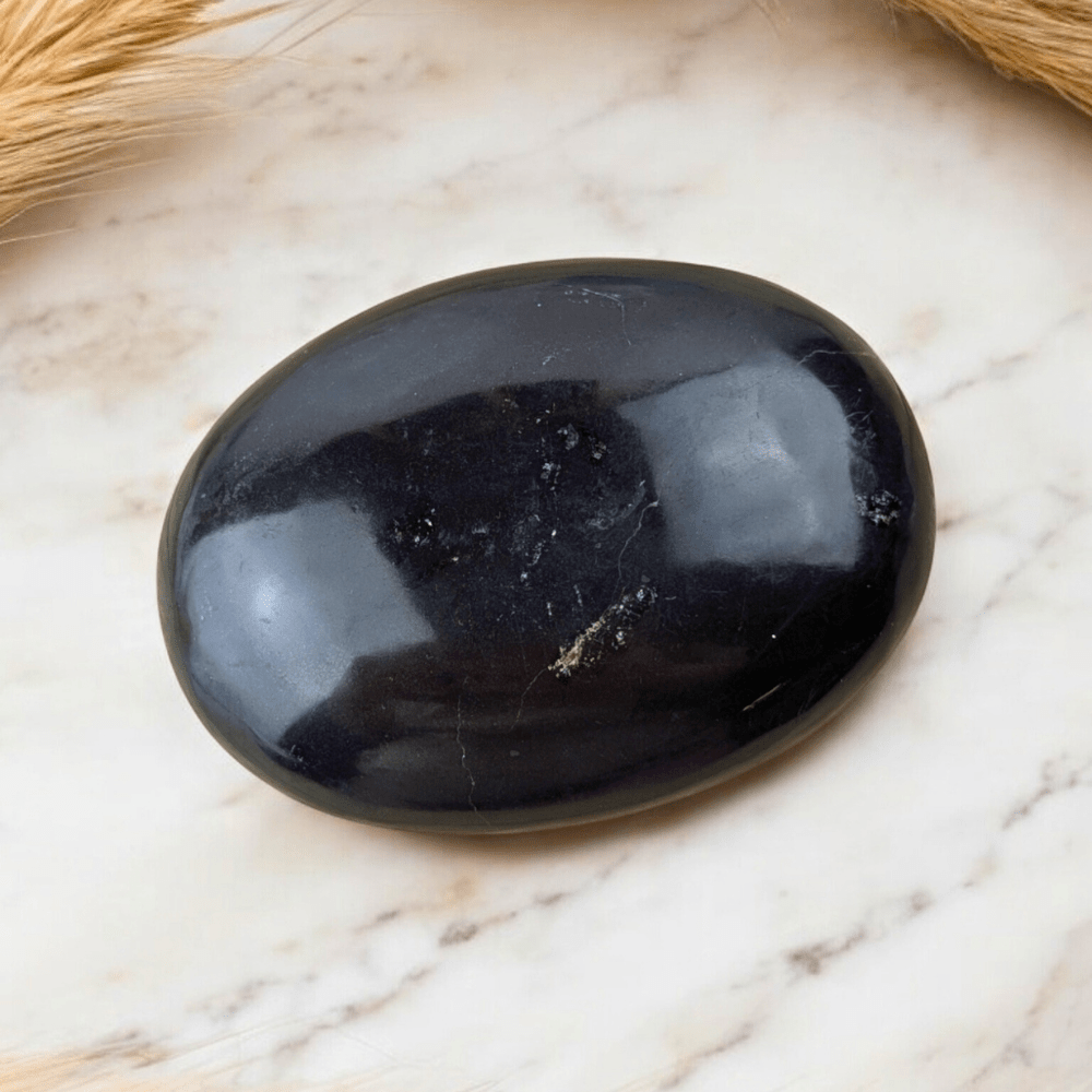 Protective Black Obsidian crystal palm stone