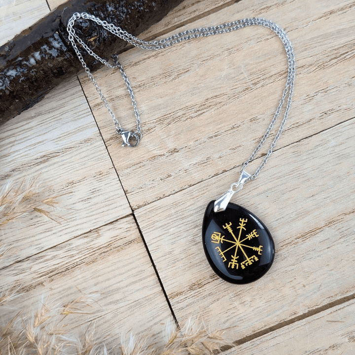 Designed to shield you from negativity and connect you to the wisdom of the past, this Black Obsidian Viking Rune Necklace is perfect for those seeking protection, stability, and strength in their daily lives.