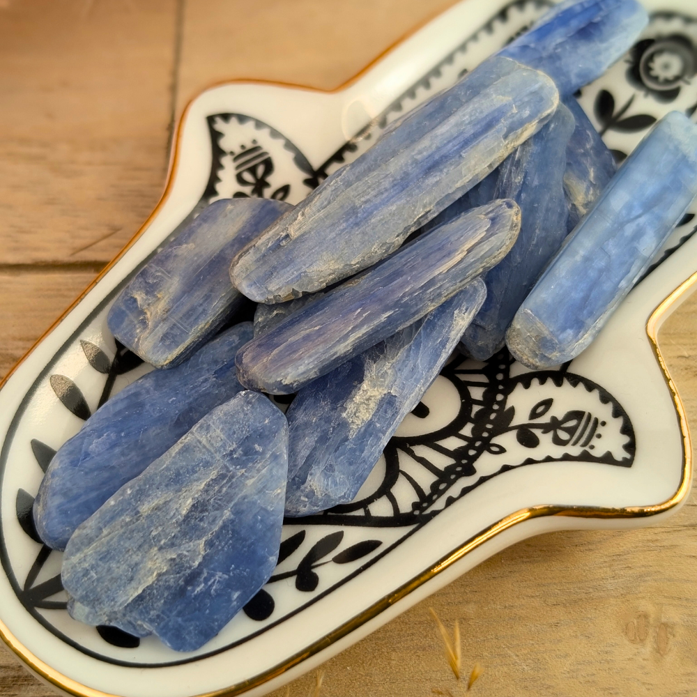 Blue Kyanite Blades in natural blue color held in hand.