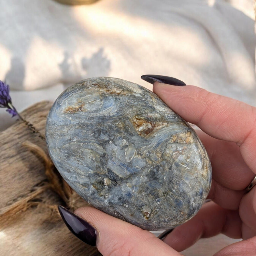 Blue Kyanite Palm Stone used for meditation and energy flow.