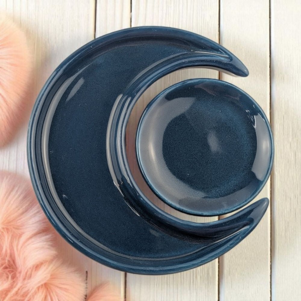 Blue ceramic dish with a unique design on a wooden surface