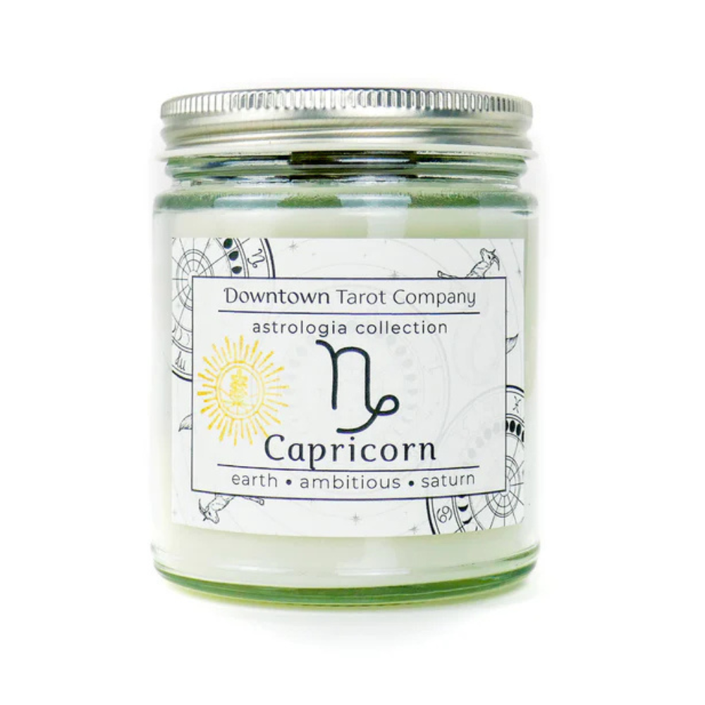 Capricorn zodiac candle with Dragon’s Blood fragrance and embedded crystals