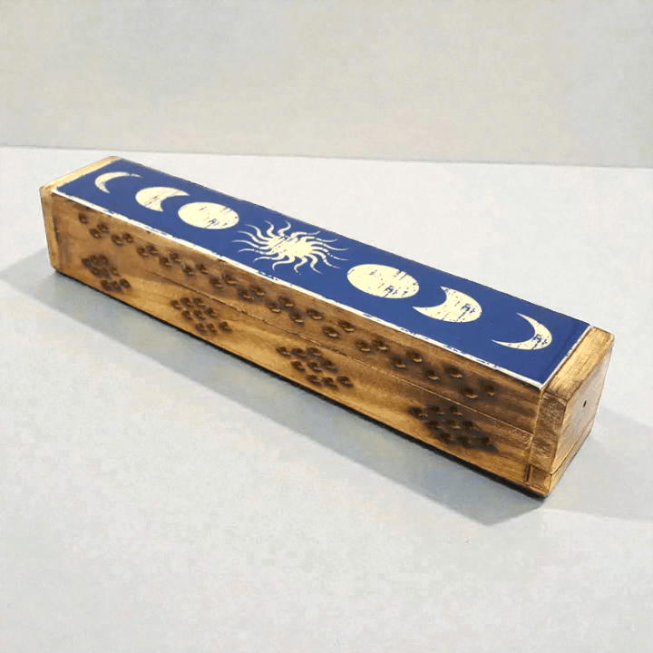 Wooden incense box with celestial design on a white background. Available at zen collection crystal store in Barrie. Shop in-store or online now.