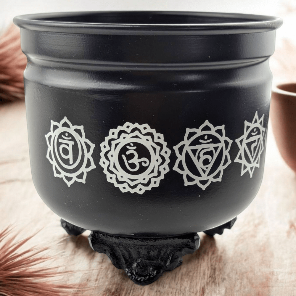 Chakra-etched metal incense burner