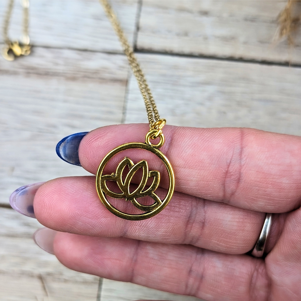 Gold-tone Circle of Hope Pendant Necklace with a lotus flower design.