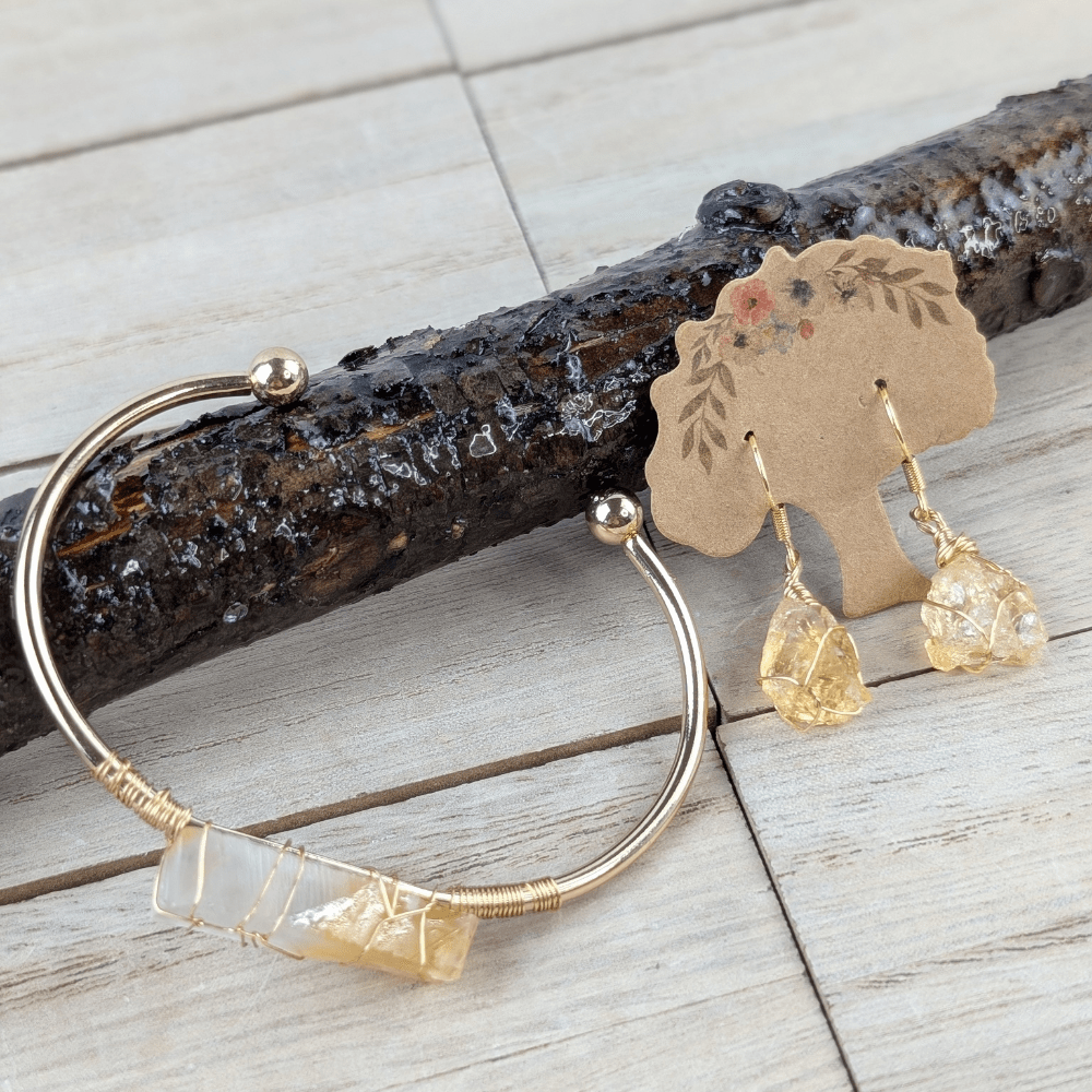 Citrine wire-wrapped bracelet on wood background.