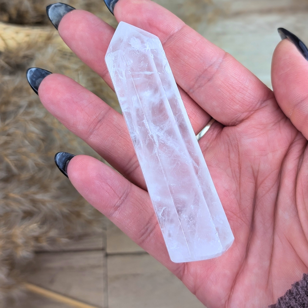 Clear Quartz Point crystal held in hand