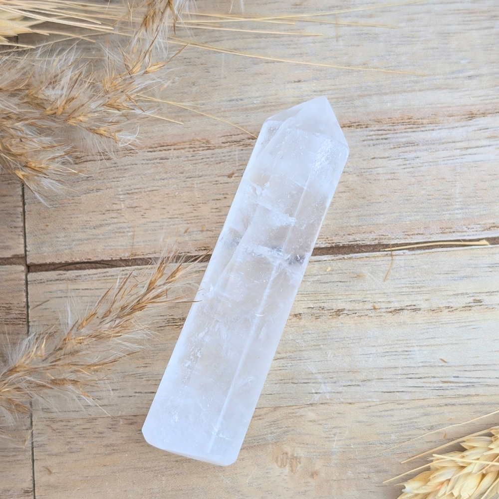 Polished Clear Quartz Point showing natural inclusions