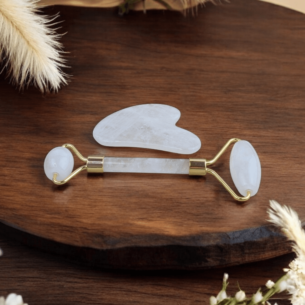 Clear Quartz Crystal Set featuring facial roller and gua sha.