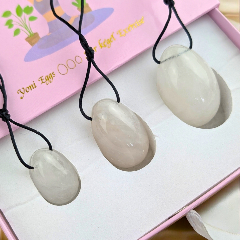 Set of clear quartz yoni eggs for wellness exploration.