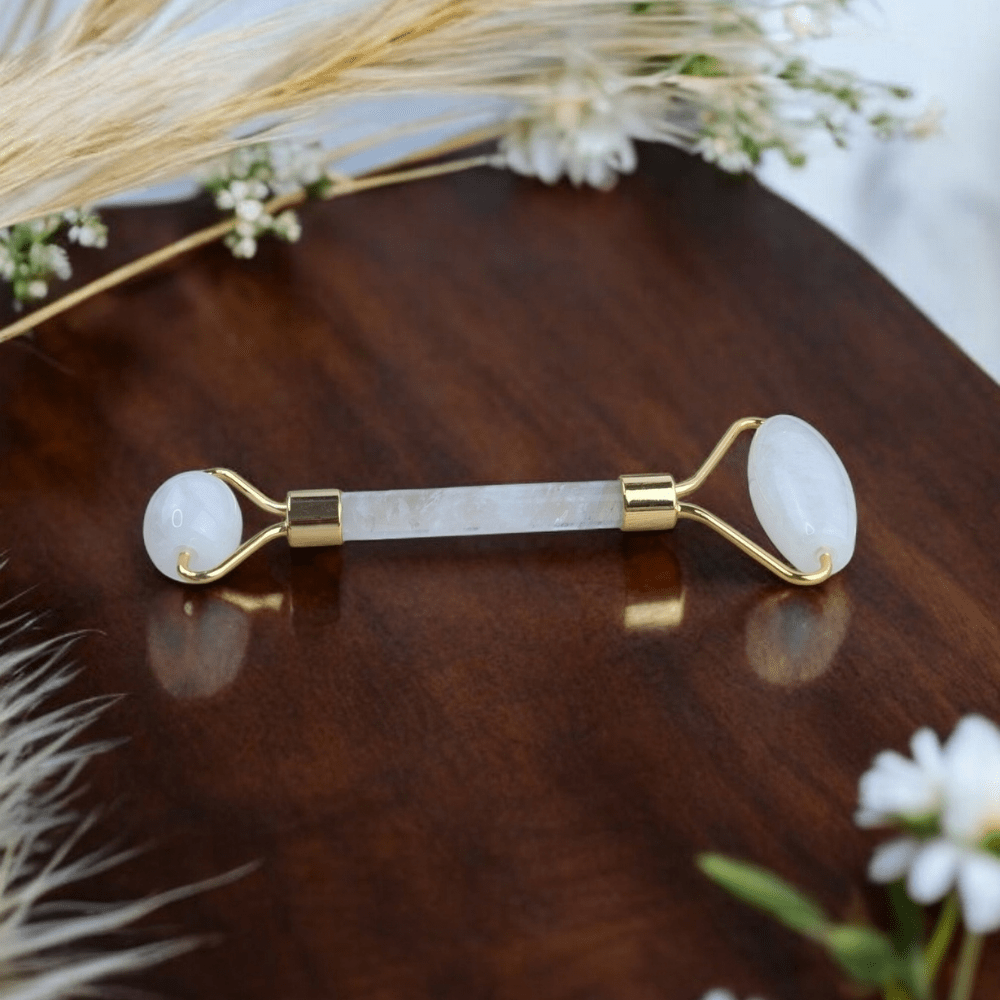 Clear quartz roller for lymphatic drainage and relaxation.