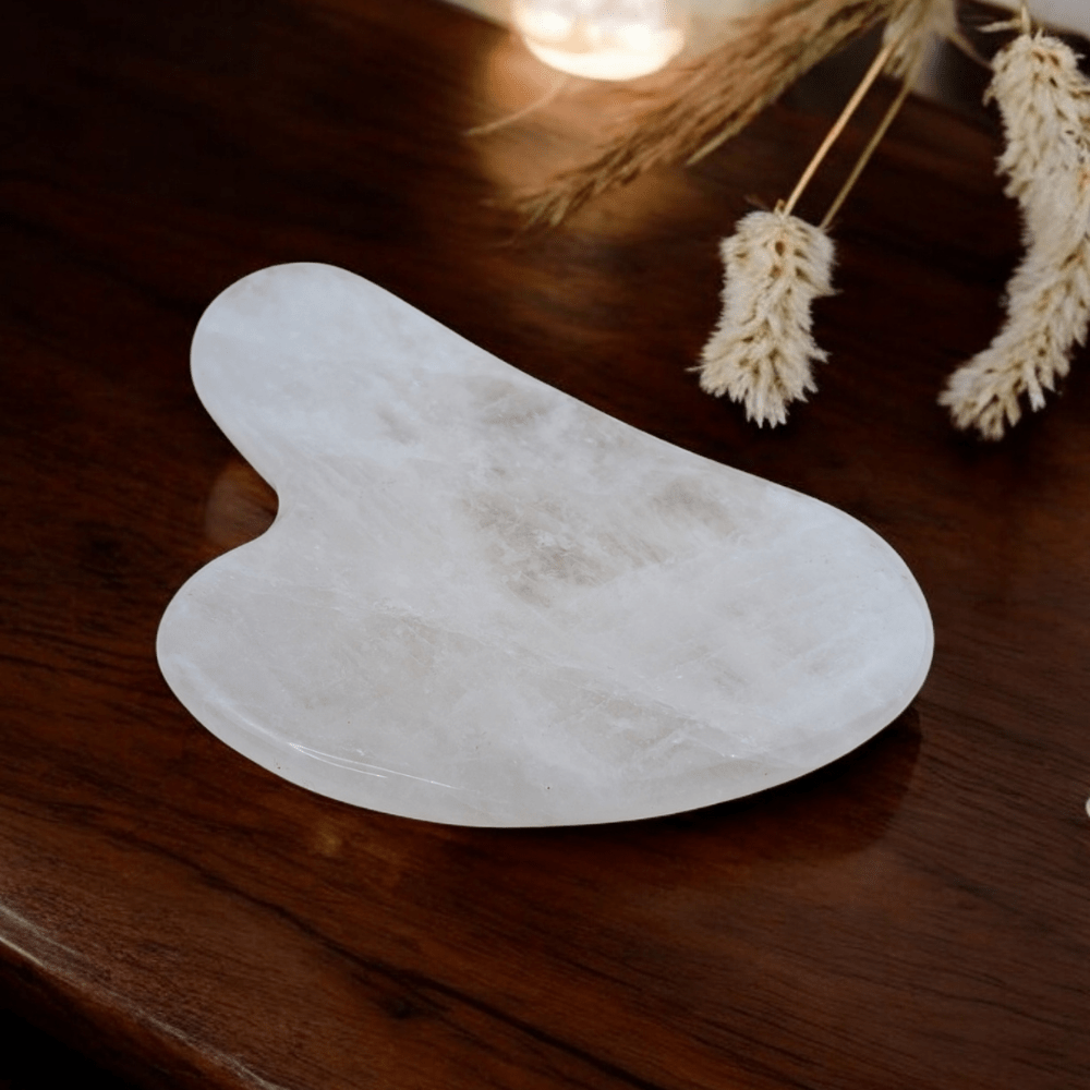 Gua sha tool made from genuine clear quartz crystal.