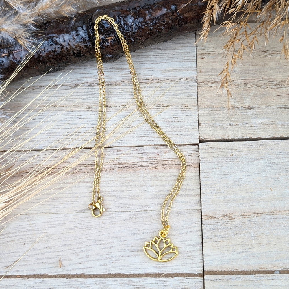 Brass lotus necklace representing purity, resilience, and spiritual growth.