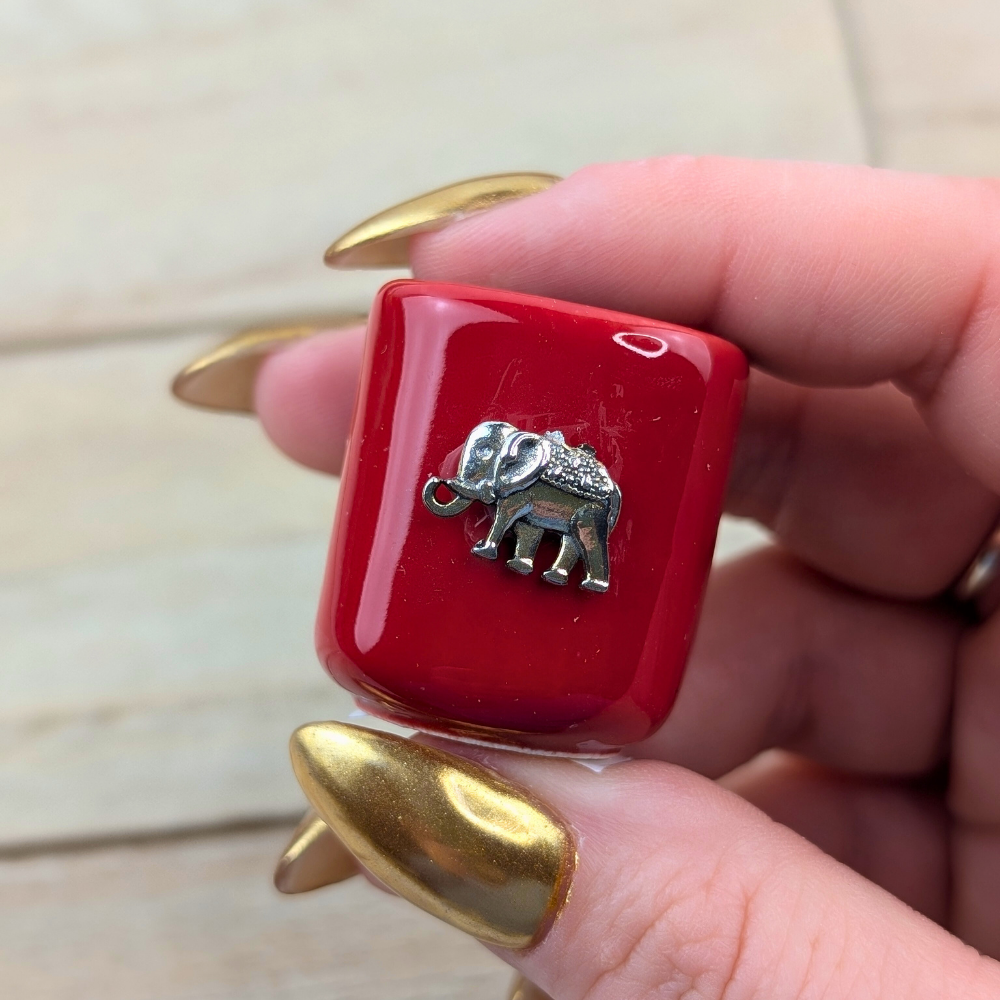 Ceramic mini candle holder with red glaze and elephant charm