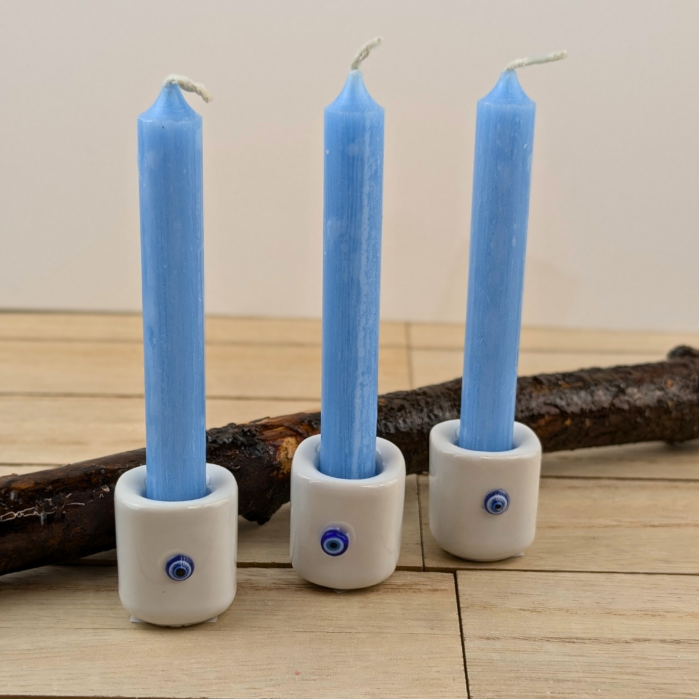 Ceramic mini candle holder with white glaze and blue evil eye