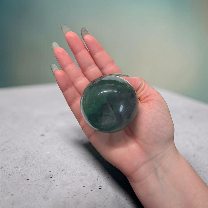 Authentic fluorite crystal sphere for overstimulation. Shop online now or in-store with zen collection metaphysical store in barrie