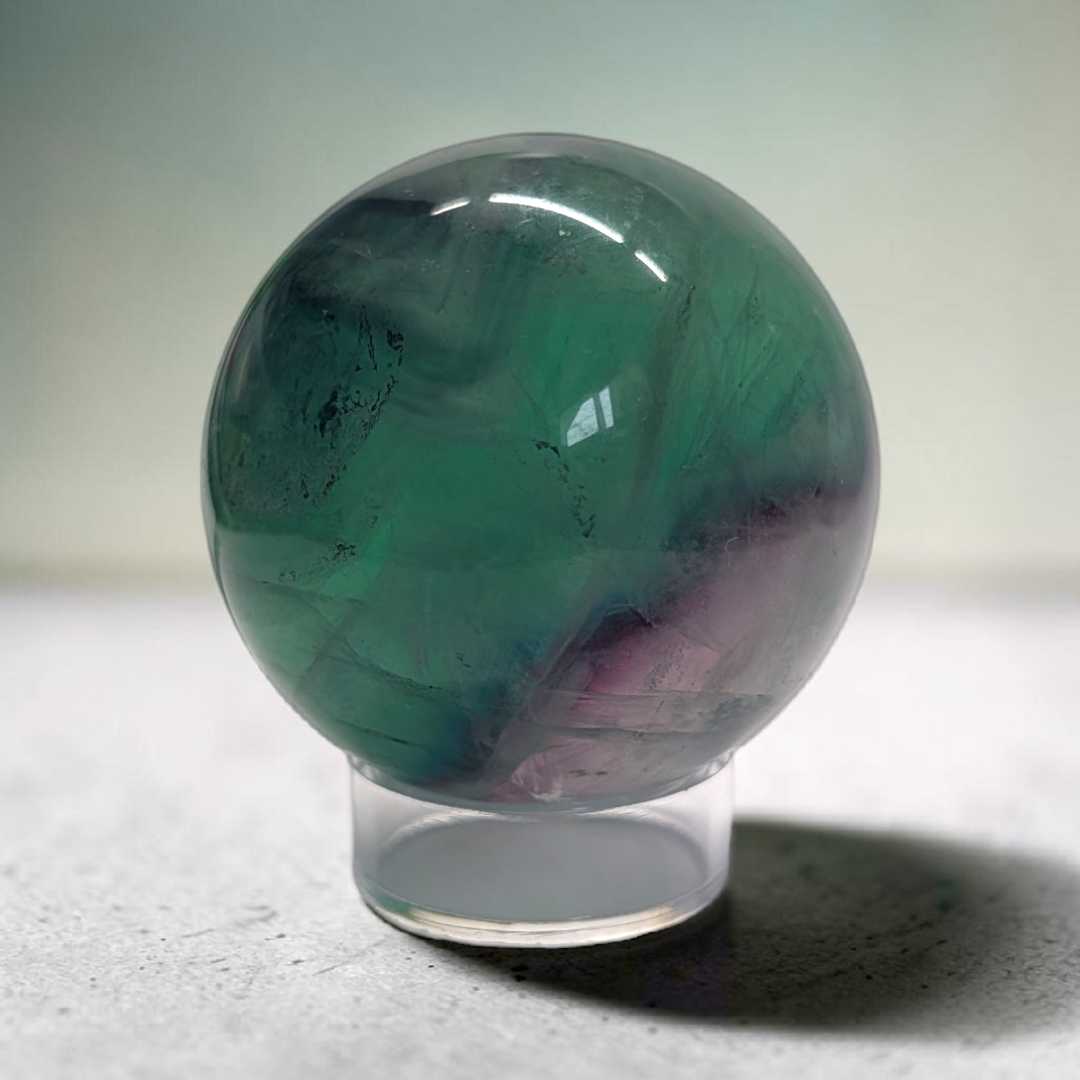 Authentic fluorite crystal sphere for overstimulation. Shop online now or in-store with zen collection metaphysical store in barrie