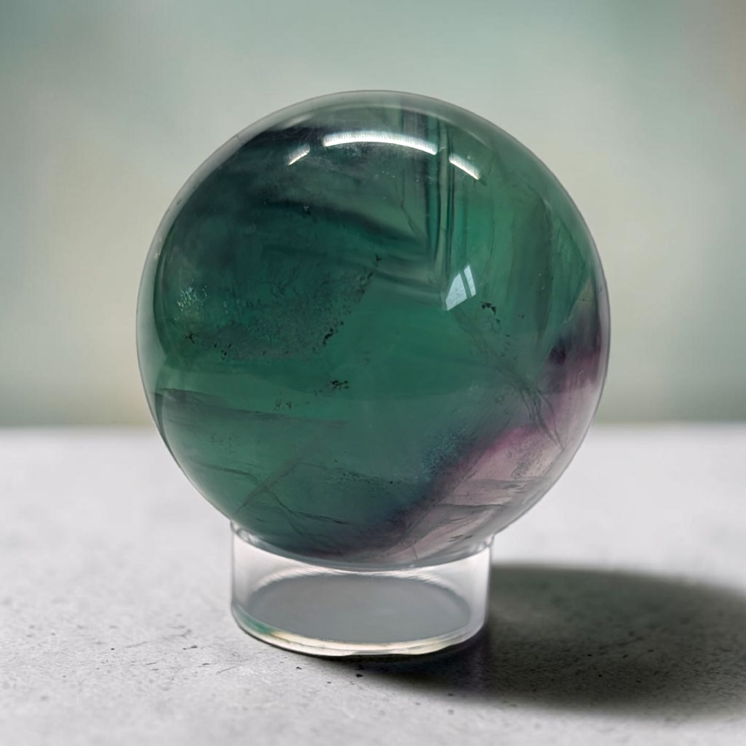 Authentic fluorite crystal sphere for overstimulation. Shop online now or in-store with zen collection metaphysical store in barrie