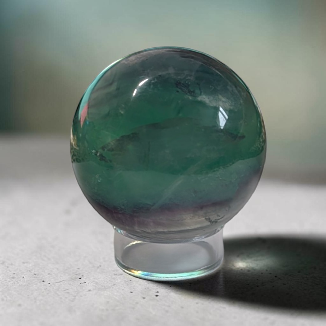 Authentic fluorite crystal sphere for overstimulation. Shop online now or in-store with zen collection metaphysical store in barrie