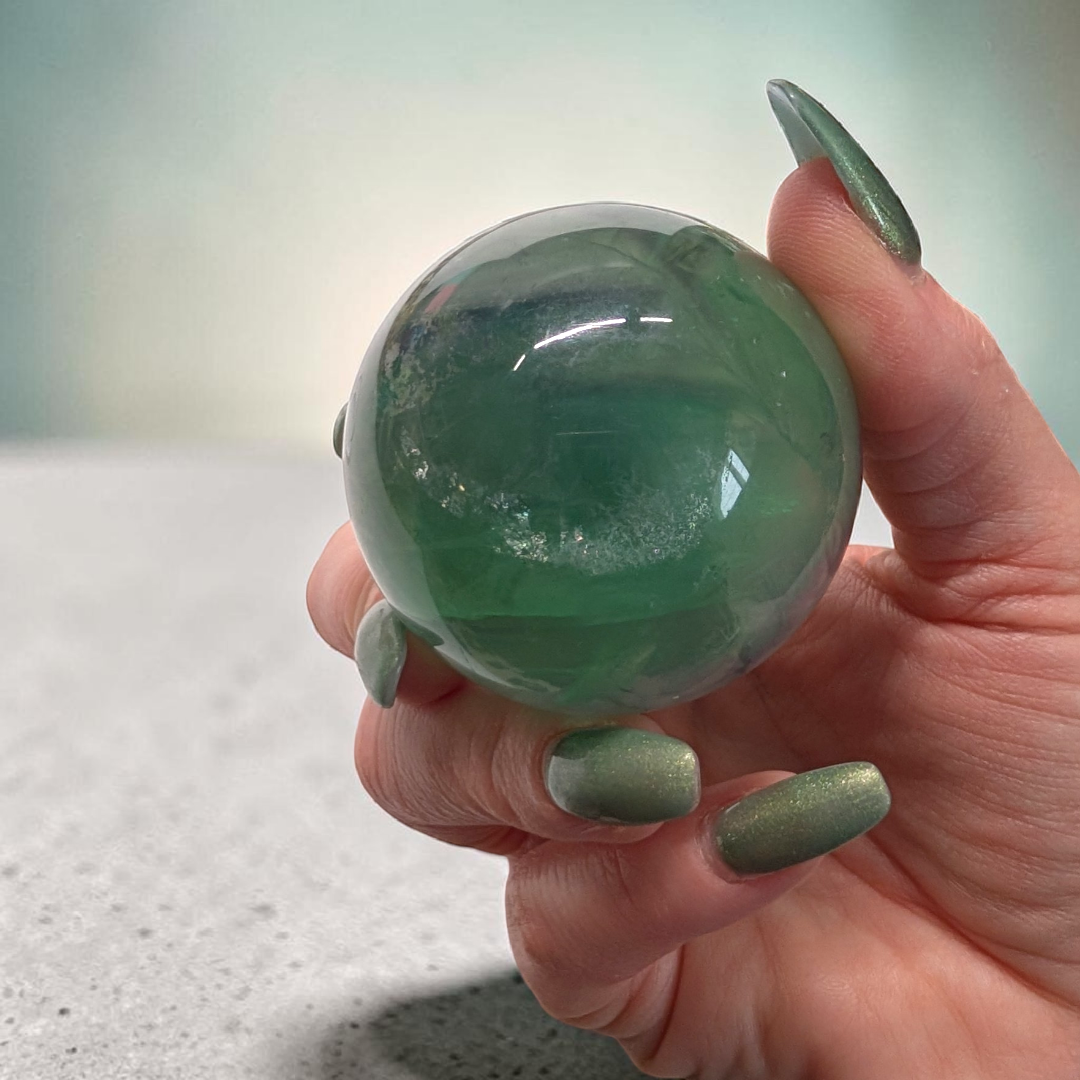 Authentic fluorite crystal sphere for overstimulation. Shop online now or in-store with zen collection metaphysical store in barrie