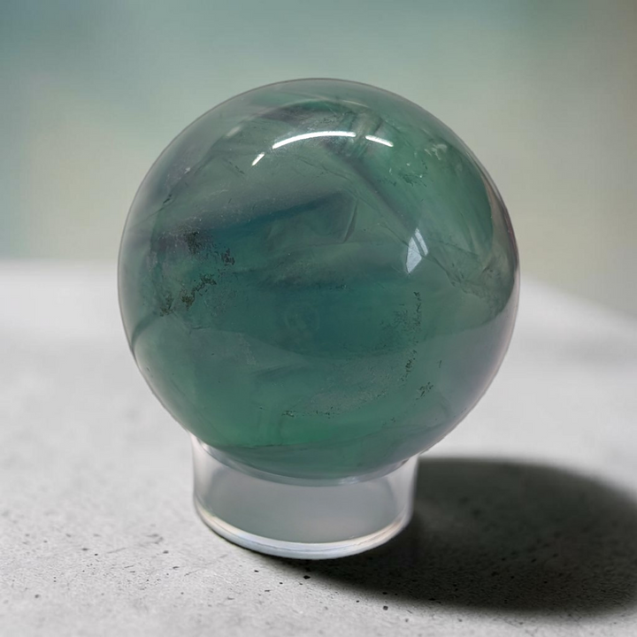 Authentic fluorite crystal sphere for overstimulation. Shop online now or in-store with zen collection metaphysical store in barrie