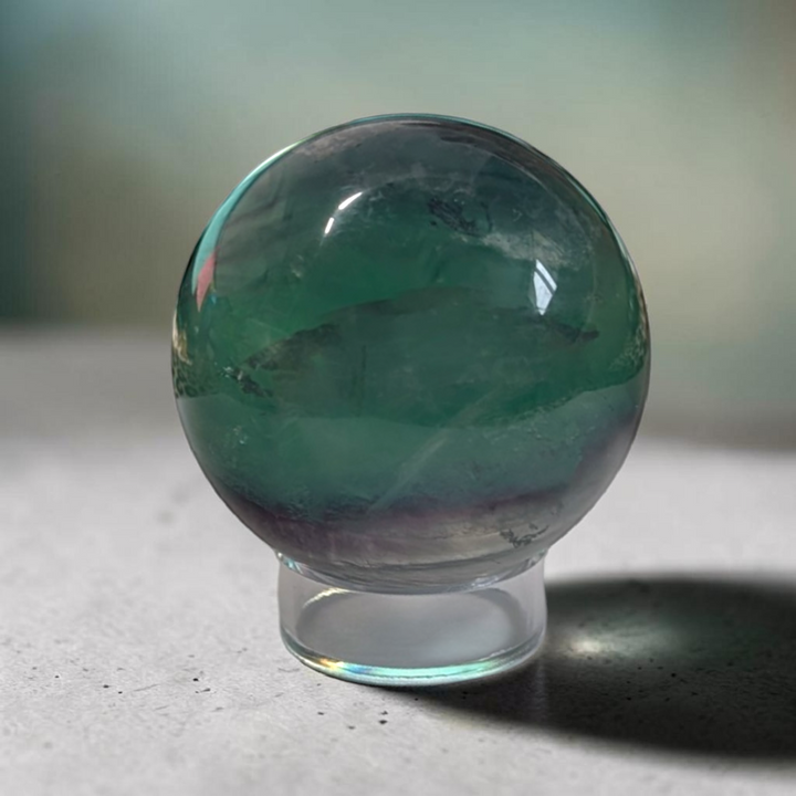 Authentic fluorite crystal sphere for overstimulation. Shop online now or in-store with zen collection metaphysical store in barrie