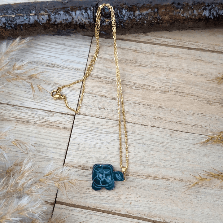 Green Agate Turtle Necklace shown in eco-friendly packaging