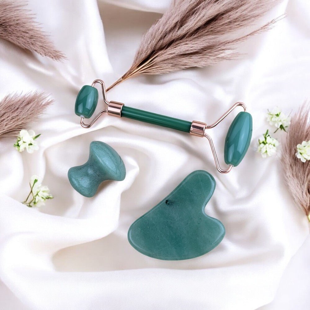 Self-care set including green aventurine roller, gua sha, and massager.