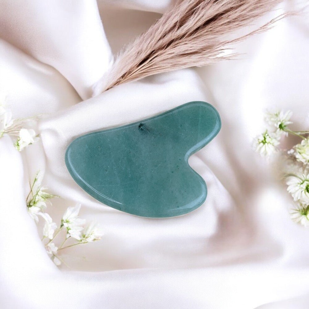 Ergonomic aventurine gua sha for skincare and energy alignment.