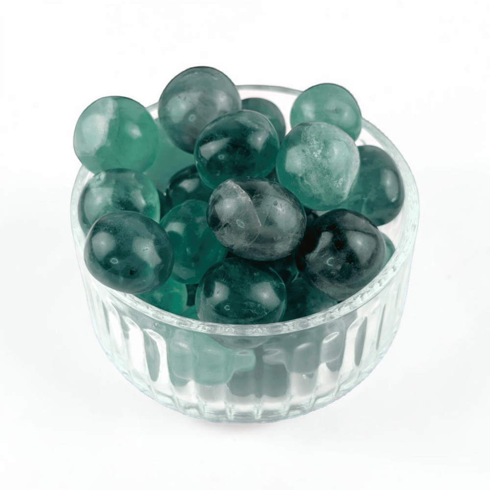 Green tumbled Fluorite on neutral background