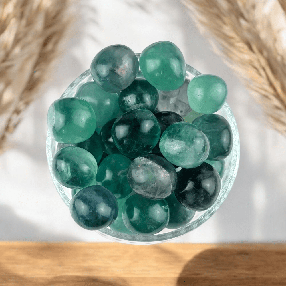 Green tumbled Fluorite on neutral background
