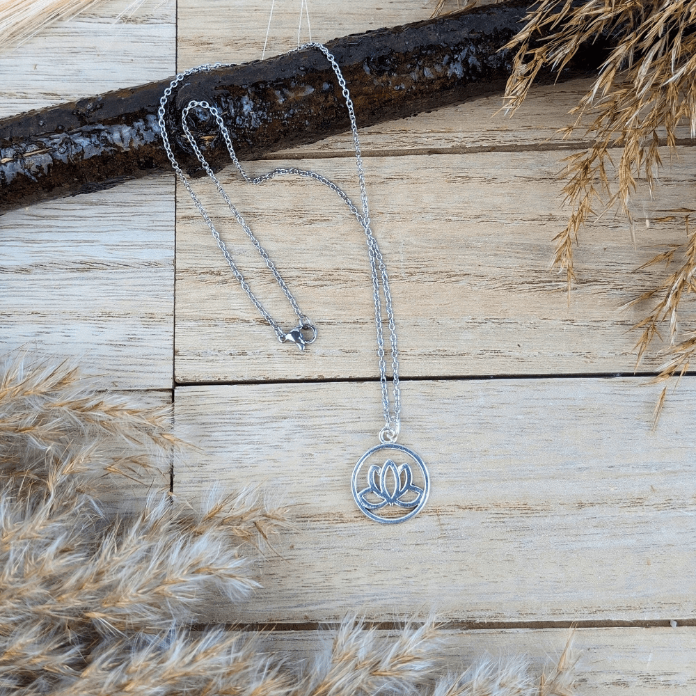Silver Guiding Lotus Necklace with a lotus flower enclosed in a circle.