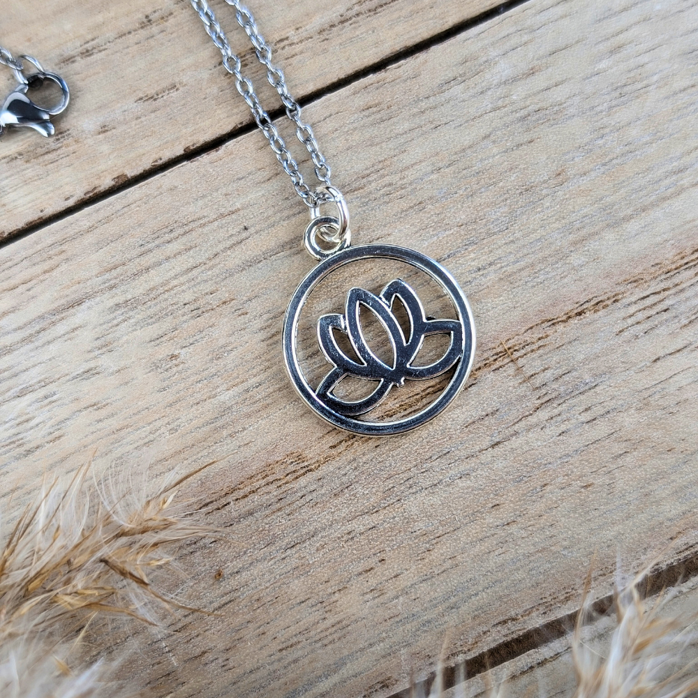 Elegant silver-tone necklace with a lotus design, perfect for spiritual journeys.