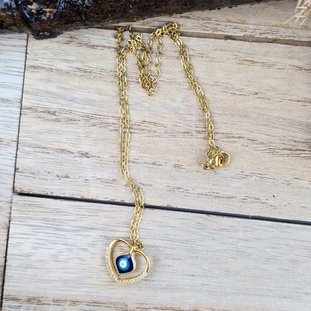 Heart of Protection Necklace displayed on a wooden background