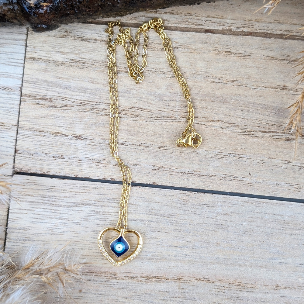 Gold-tone Heart of Protection Necklace with an evil eye design