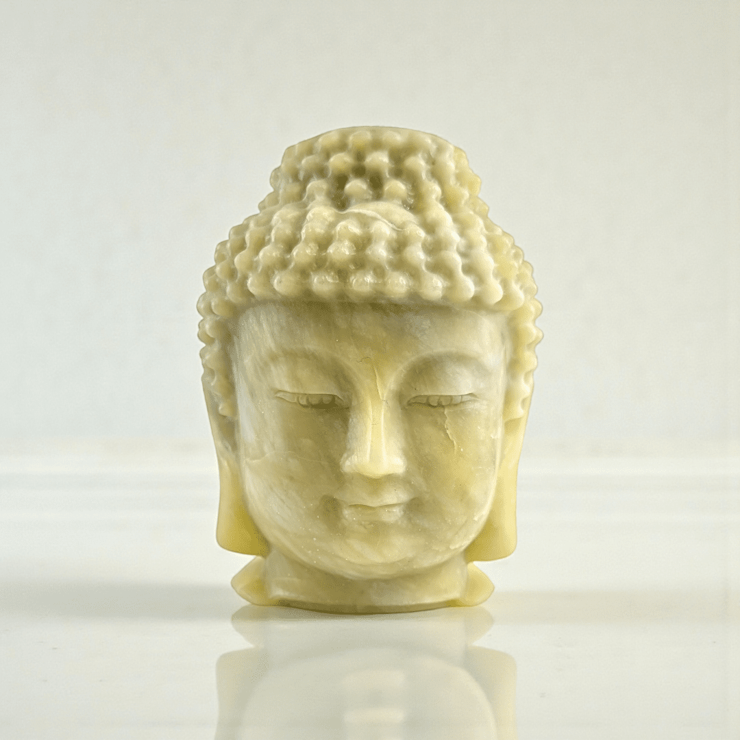 Polished jade crystal Buddha head statue statement piece for meditation space. available at zen collection Canadian metaphysical store near me Barrie