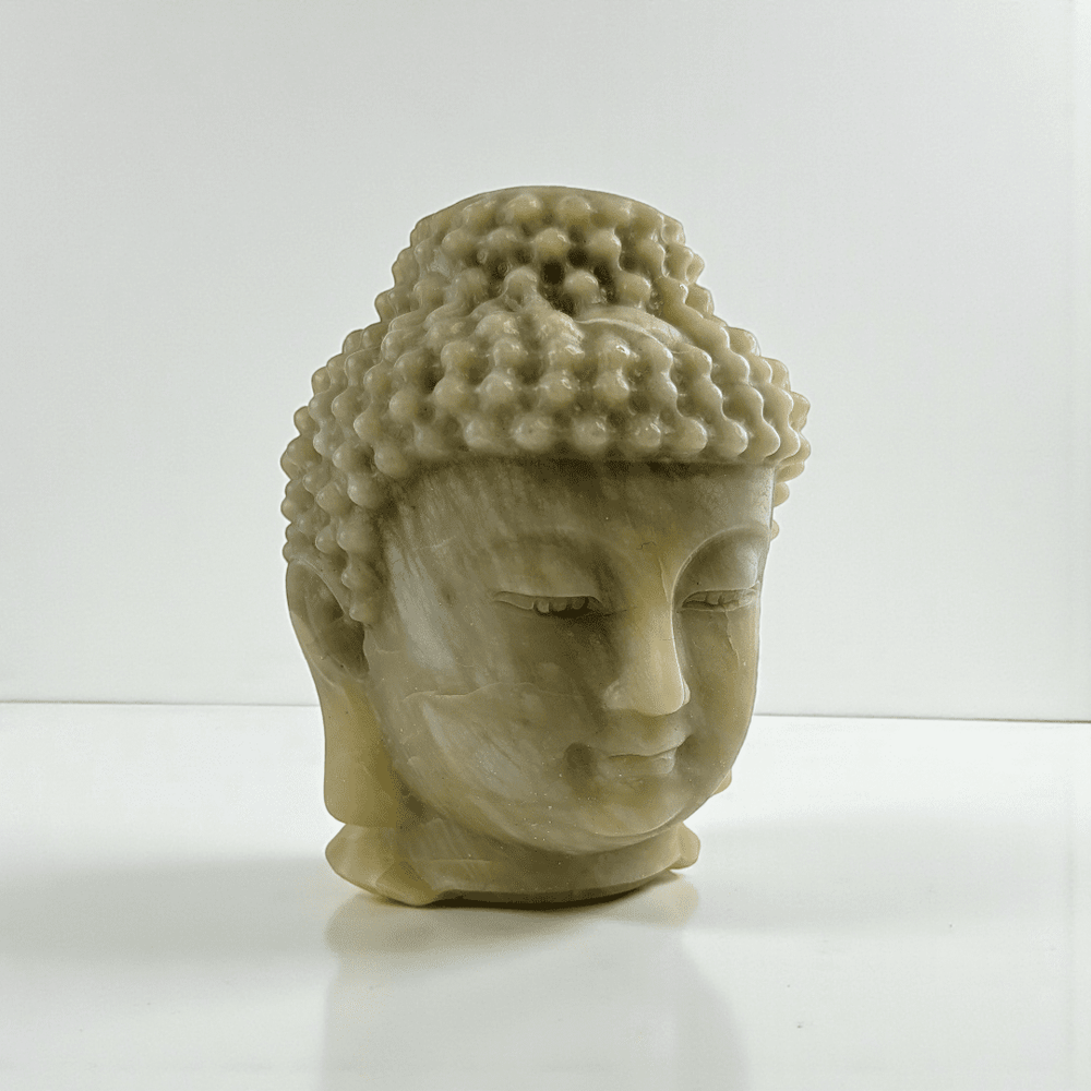 Polished jade crystal Buddha head statue statement piece for meditation space. available at zen collection Canadian metaphysical store near me Barrie